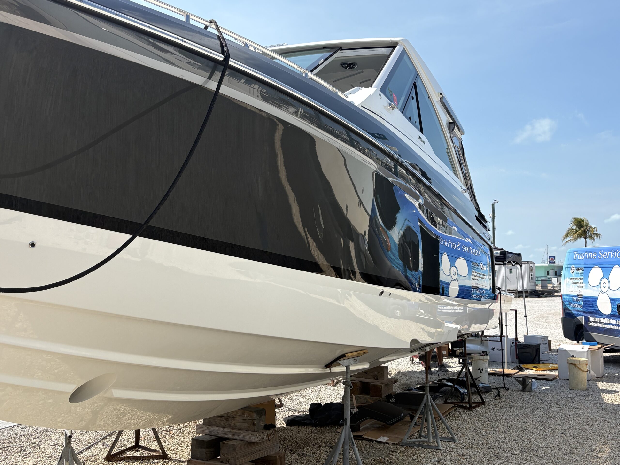 Clean yacht hull receiving mobile exterior care in the Florida Keys