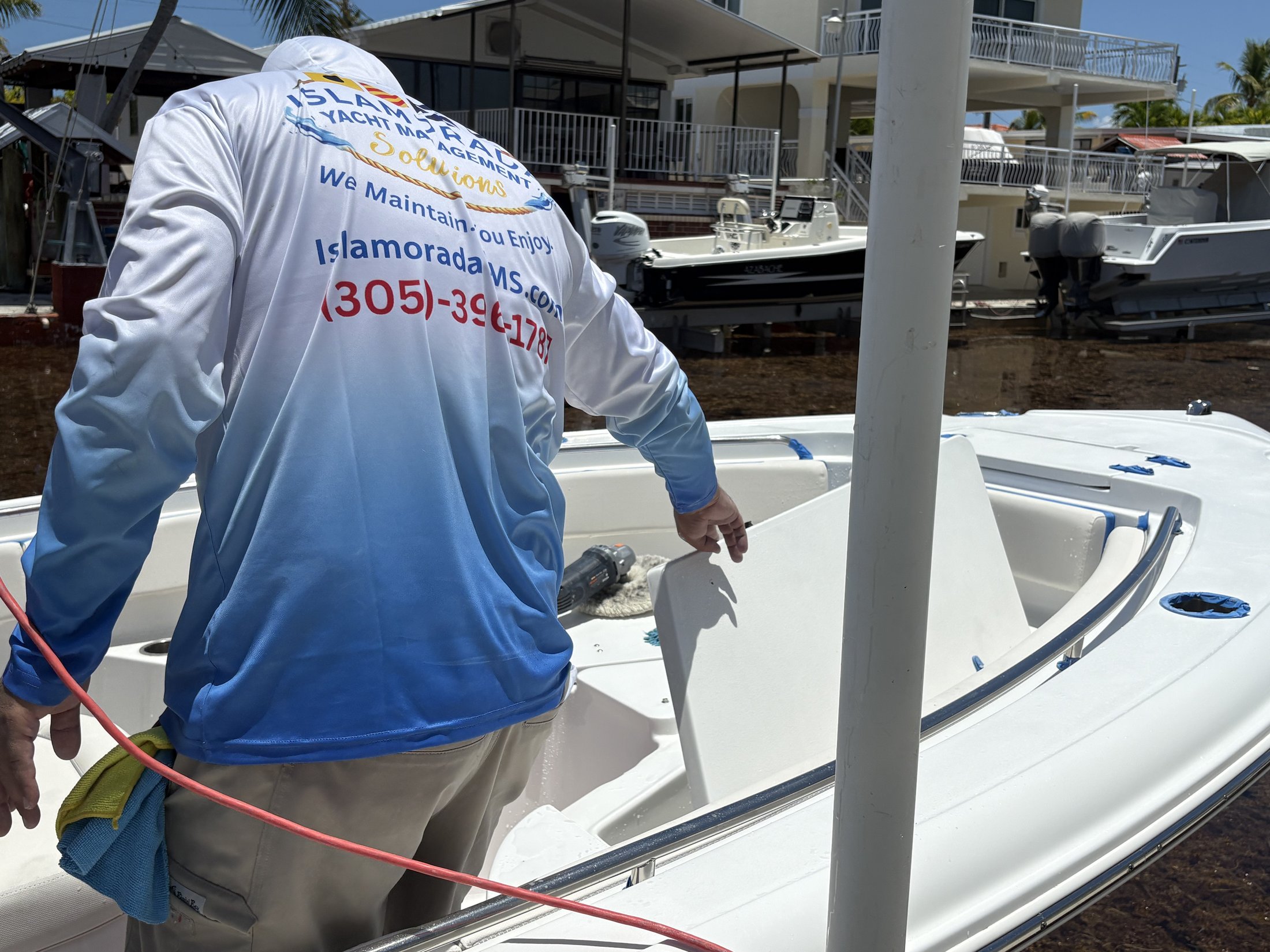 IYMS technician working aboard a center console