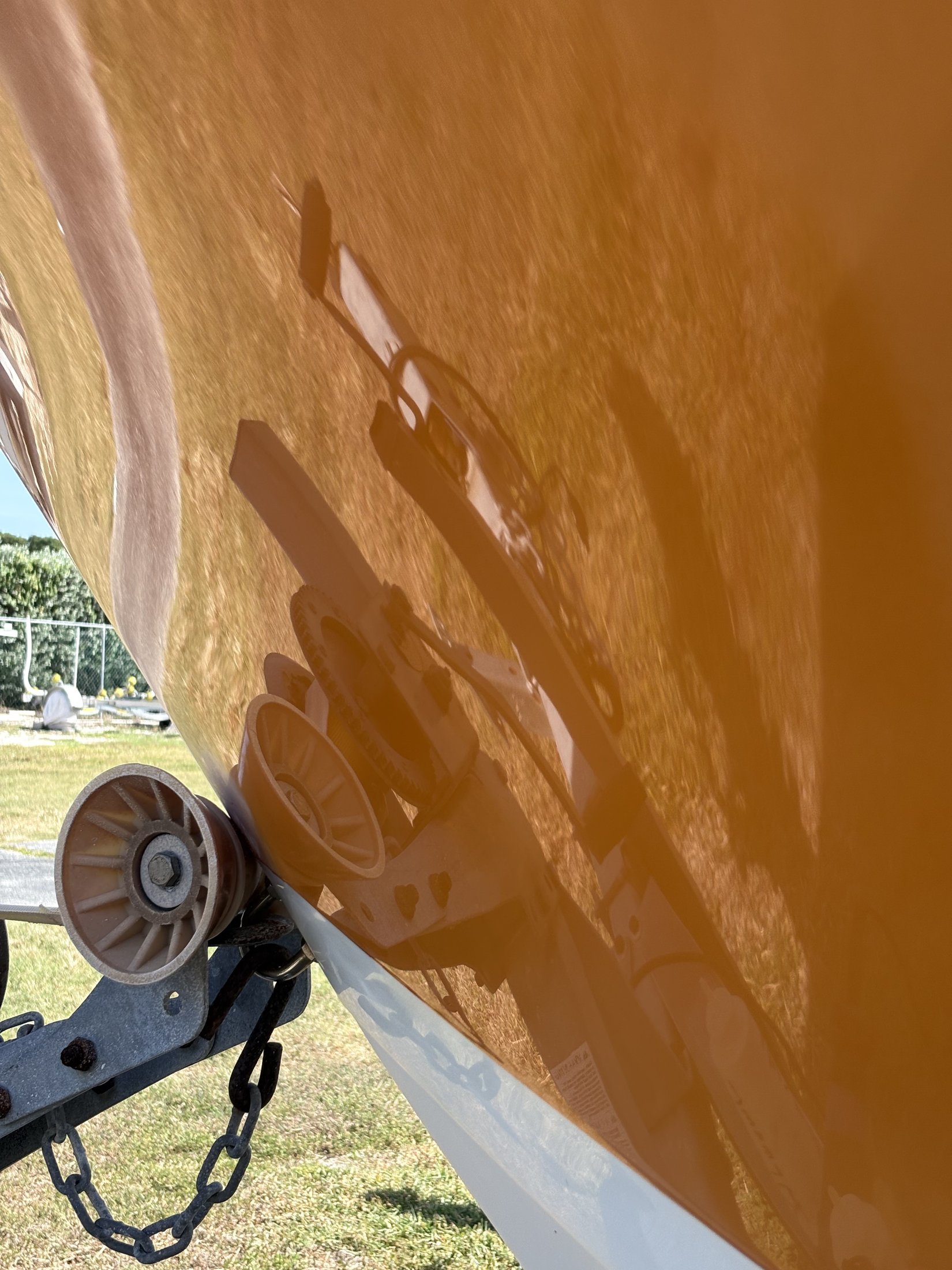 Glossy orange gelcoat hull detail