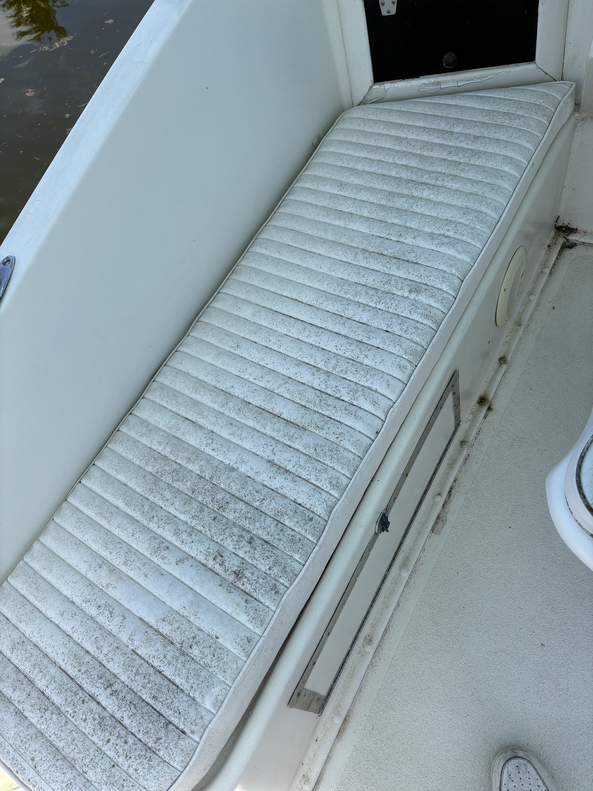 Before deep cleaning: mildew-stained cockpit seating on the 1971 Hatteras 36 Sportfish Convertible Remimar