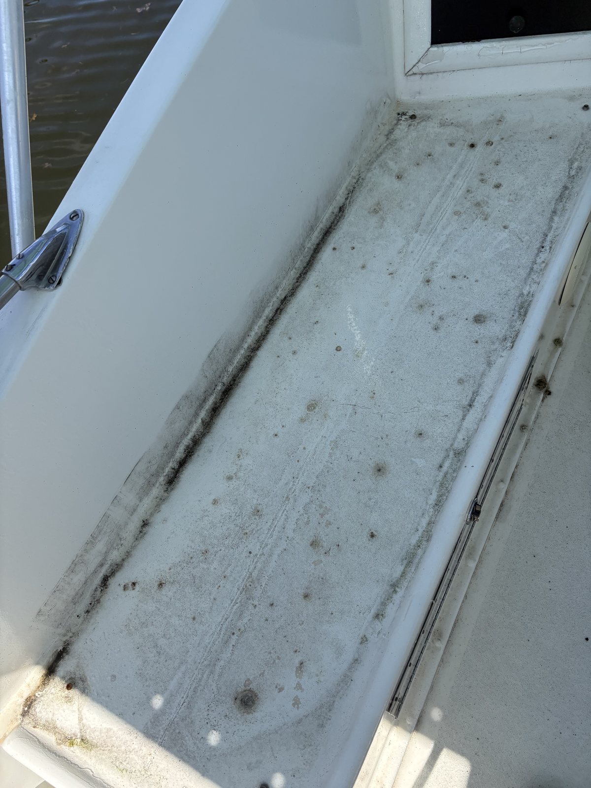 Before deep cleaning: mildew and grime along the port exterior of the 1971 Hatteras 36 Sportfish Convertible Remimar