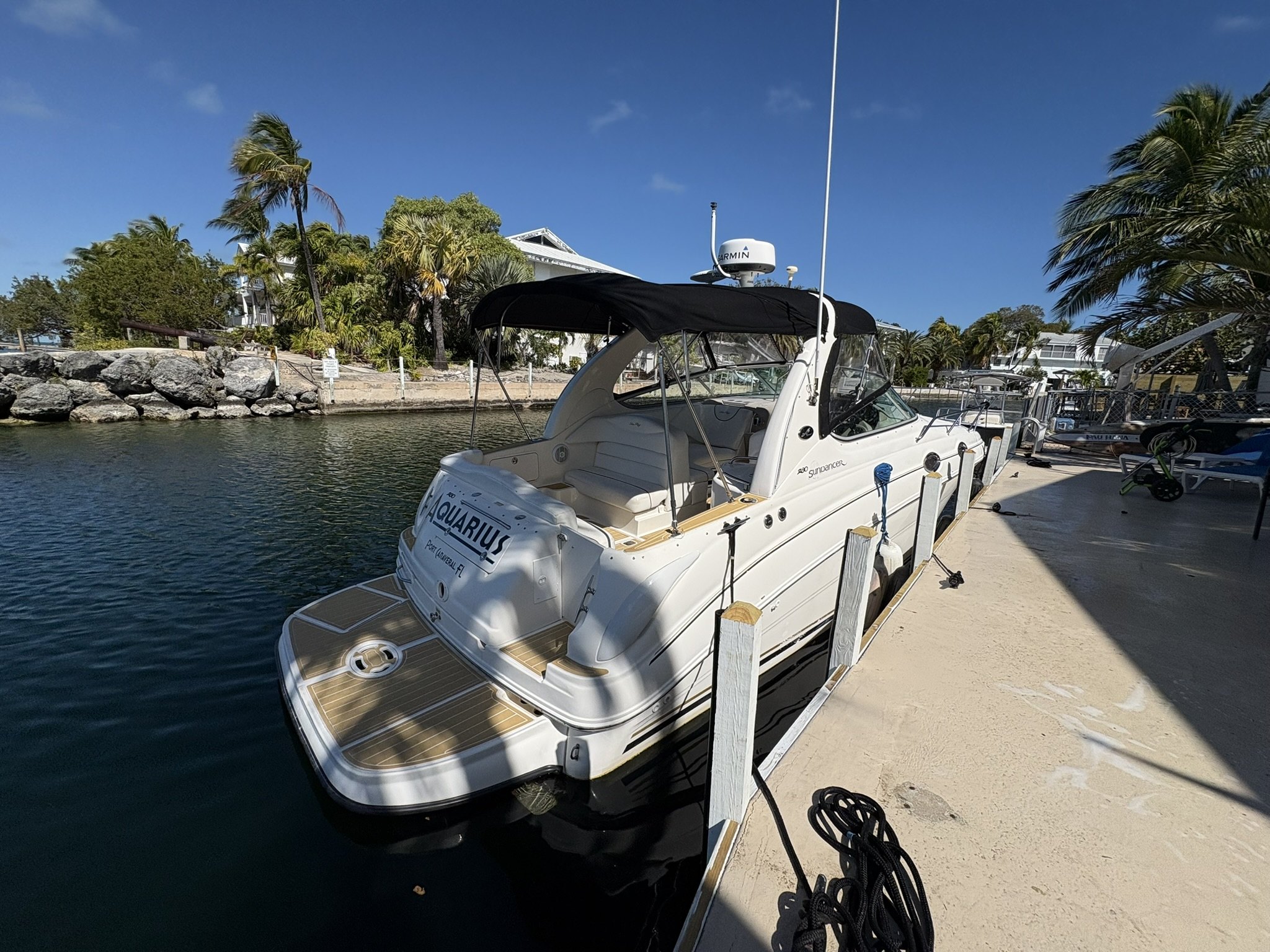 Sea Ray 340 cruiser dockside after detailing at a seawall dock
