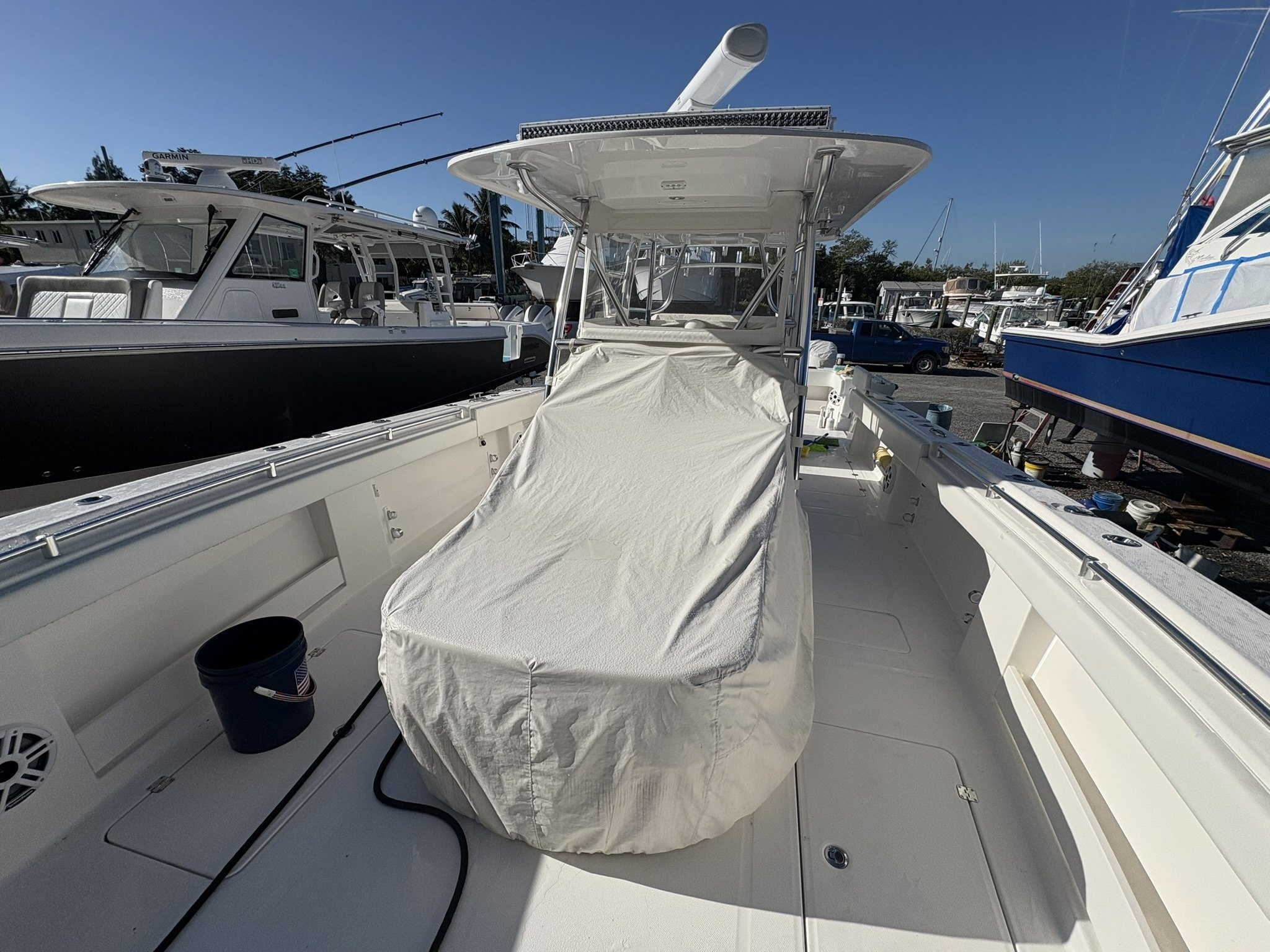 Center console with protected helm cover during yard-side detailing service