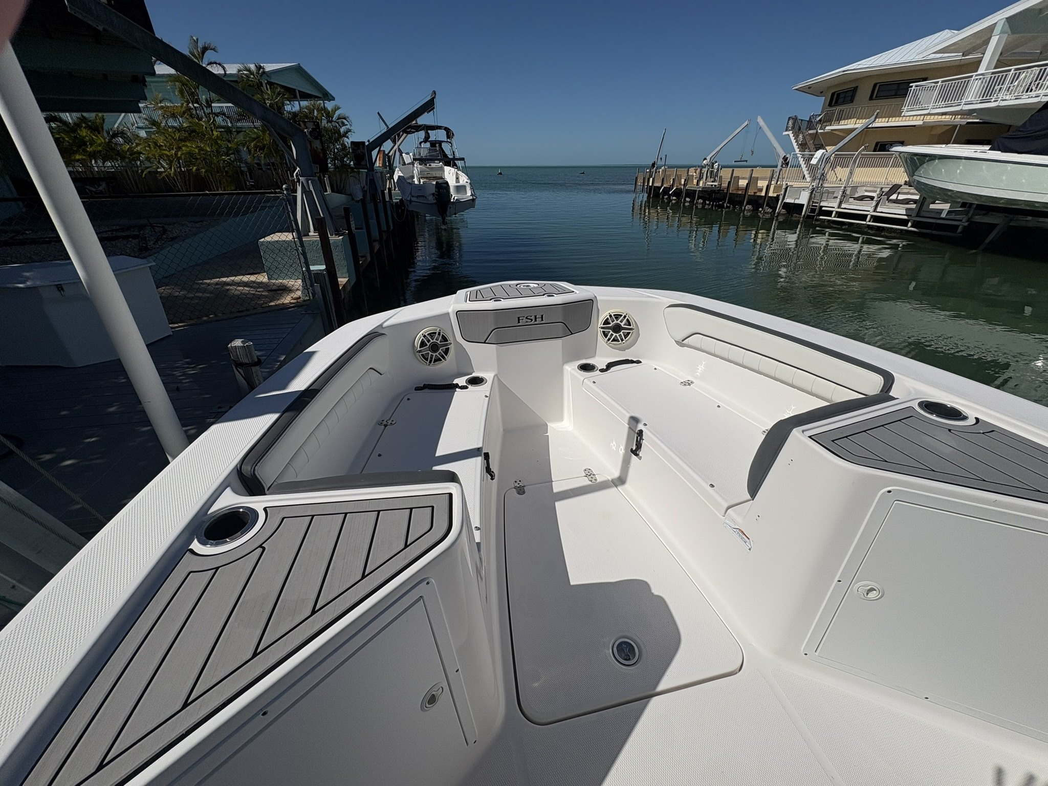 Clean bow deck and non-skid after detailing at a canal-front dock in the Keys