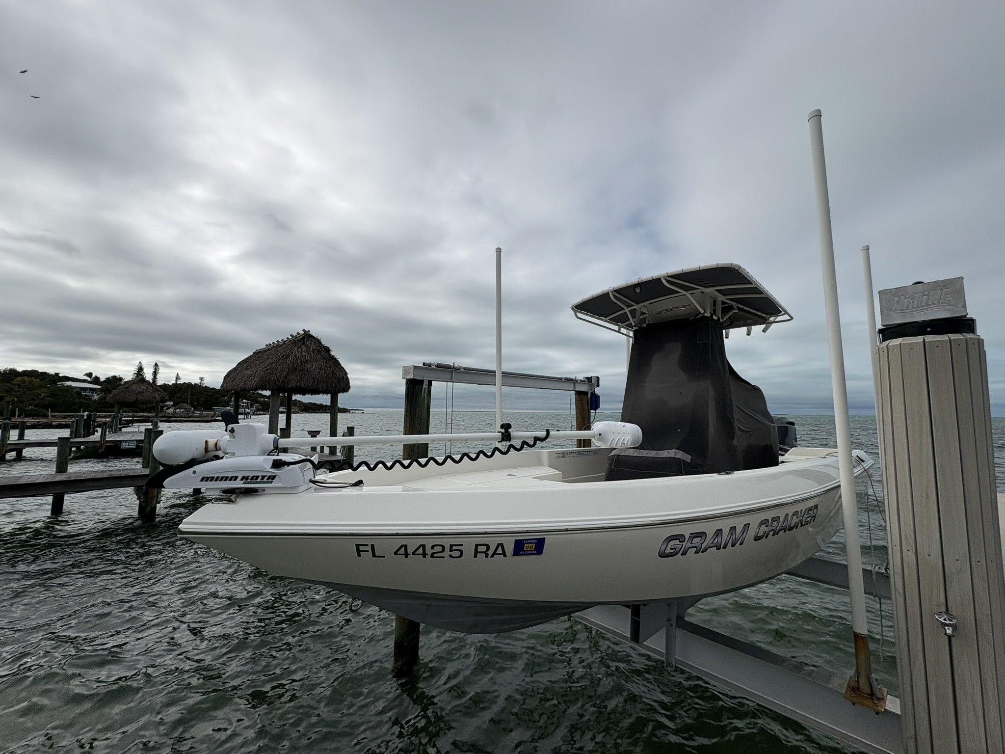 Bay boat on a lift after dockside detailing in Islamorada