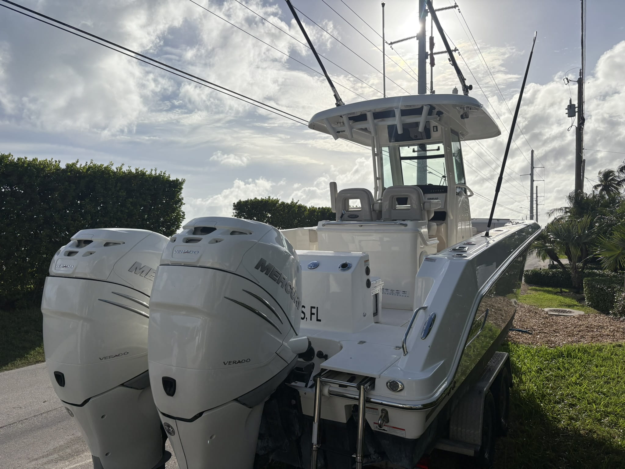 Twin Mercury Verado outboards and transom after cowling polish and detailing